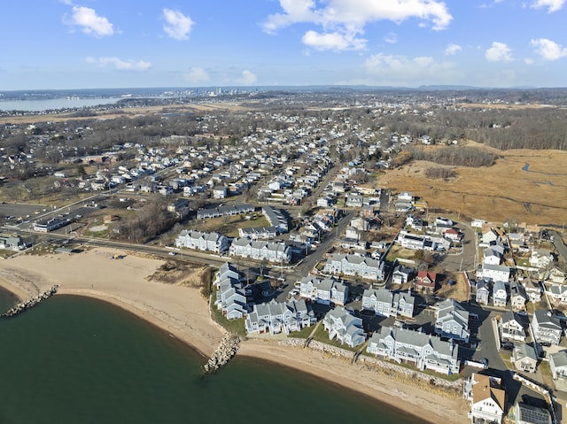 drone / aerial view with a water view and a view of the beach