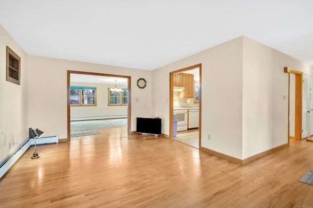 empty room featuring baseboard heating, light hardwood / wood-style floors, and an inviting chandelier