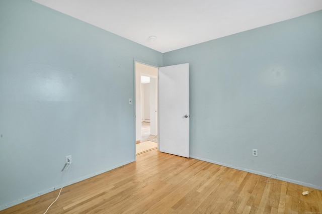 spare room featuring light wood-type flooring