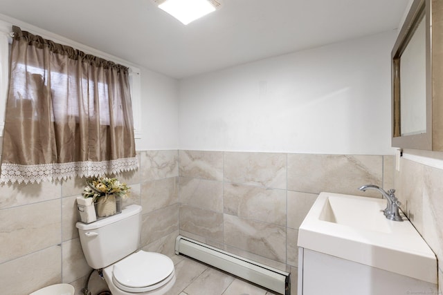 bathroom featuring vanity, a baseboard radiator, toilet, and tile walls