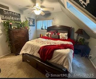 carpeted bedroom with ceiling fan and lofted ceiling