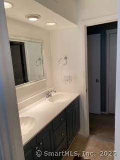 bathroom with tile patterned floors and vanity