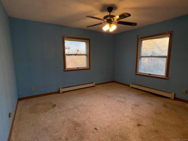 empty room with ceiling fan and a baseboard radiator