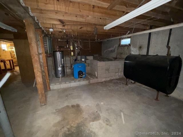 basement featuring water heater