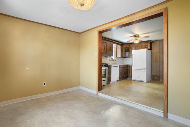 kitchen with white appliances, ceiling fan, crown molding, and sink