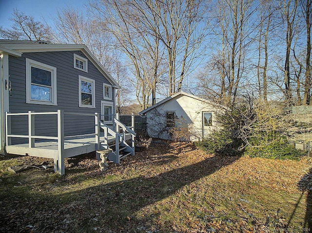 view of side of home featuring a wooden deck