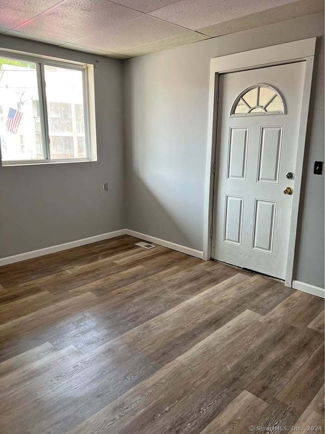 foyer featuring a paneled ceiling and hardwood / wood-style flooring