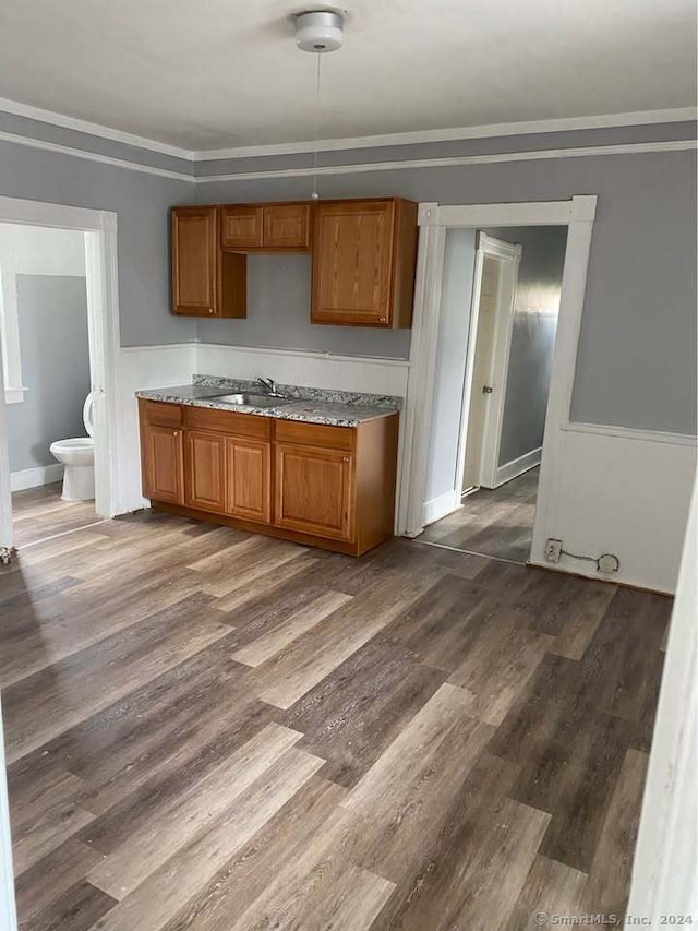 kitchen with hardwood / wood-style floors and sink