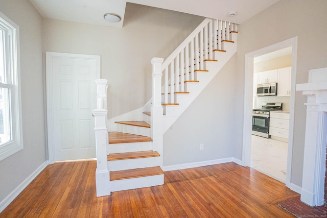 stairway with wood-type flooring