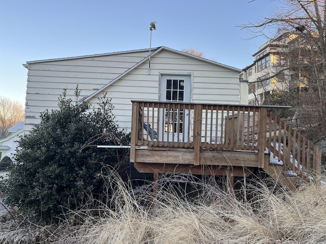 back of house featuring a wooden deck