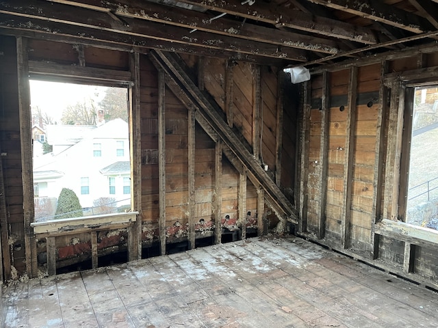 unfinished attic featuring plenty of natural light