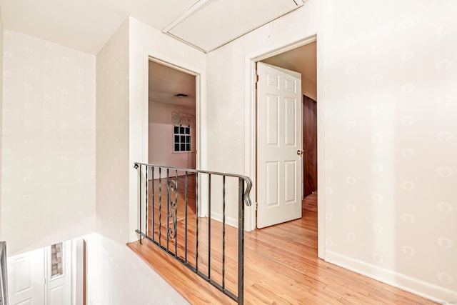 corridor with light wood-type flooring