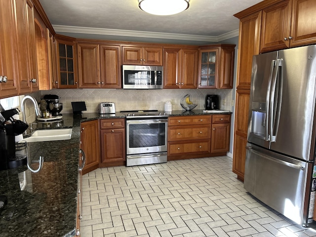 7 Varian Dr, Danbury, CT 06811 - kitchen featuring stainless steel appliances, a sink, brown cabinetry, decorative backsplash, and ornamental molding