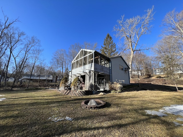 exterior space with a sunroom and a front lawn