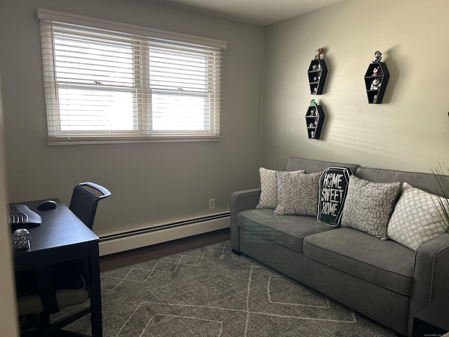 living area featuring a baseboard radiator and wood finished floors