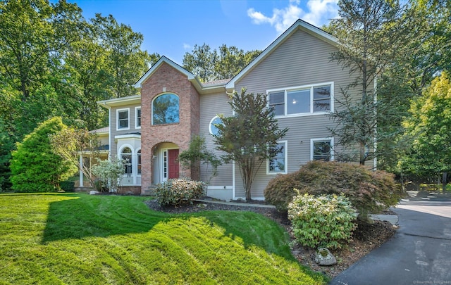 front facade with a front yard