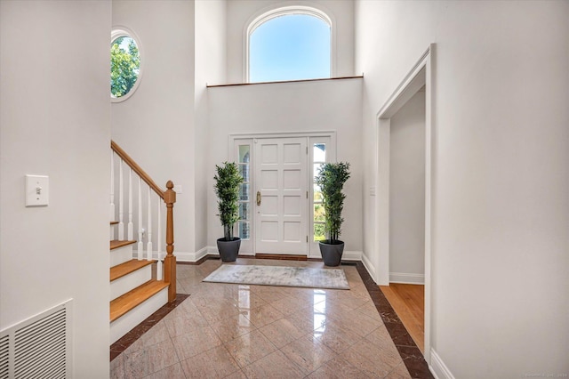 entrance foyer with a towering ceiling