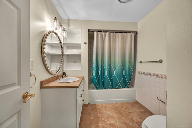 full bathroom featuring vanity, toilet, tile walls, and shower / tub combo