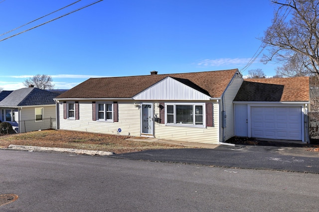 ranch-style house featuring a garage