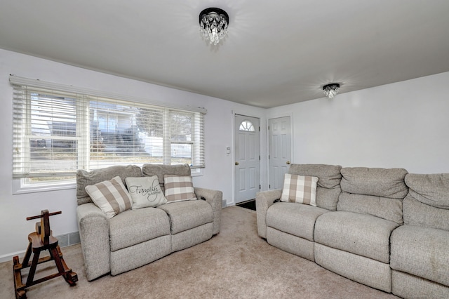 living room with carpet flooring and a wealth of natural light