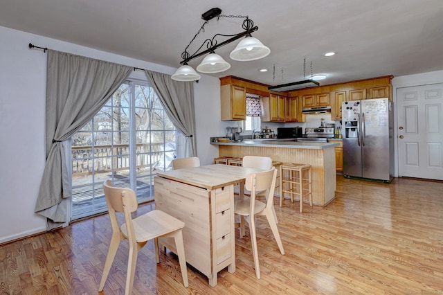 dining room featuring light hardwood / wood-style flooring