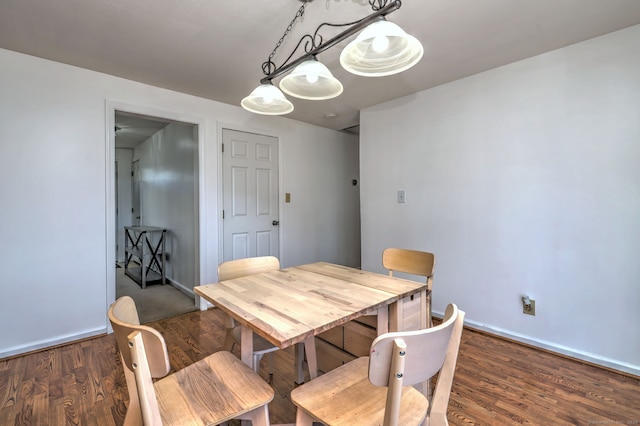 dining room with dark wood-type flooring