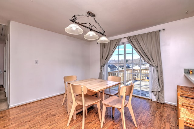 dining space featuring hardwood / wood-style flooring