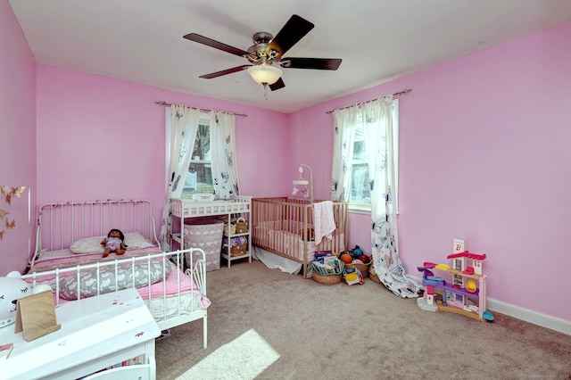 carpeted bedroom featuring ceiling fan