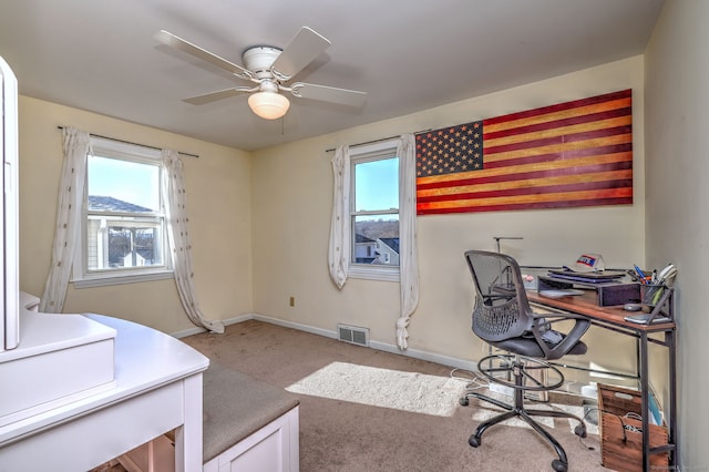 office space featuring light colored carpet and ceiling fan