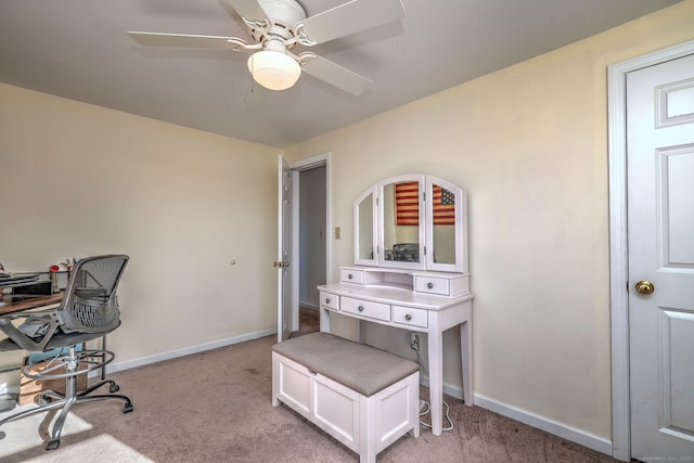 office space with ceiling fan and light colored carpet