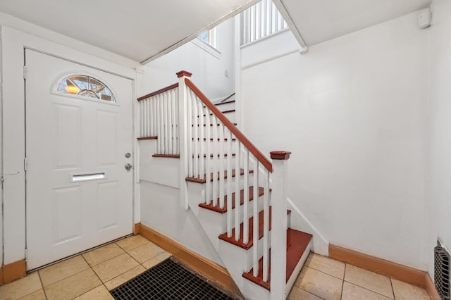 foyer with light tile patterned flooring