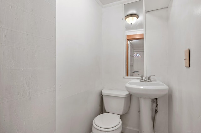 bathroom featuring sink and toilet