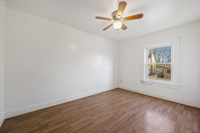 spare room featuring ceiling fan and wood-type flooring