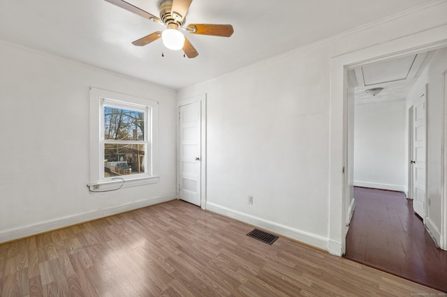 spare room featuring ceiling fan and hardwood / wood-style floors