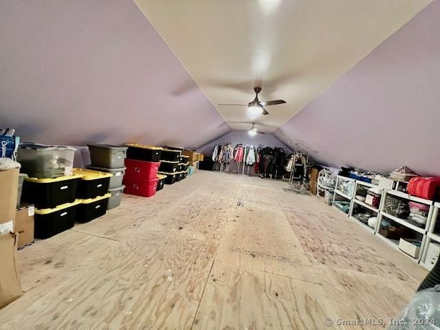 bonus room featuring a ceiling fan and vaulted ceiling