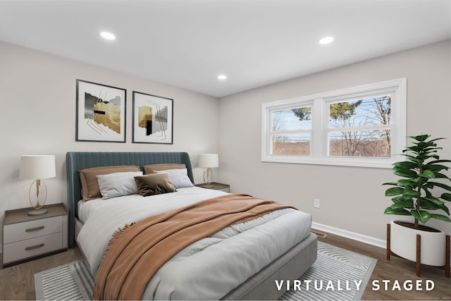 bedroom with dark hardwood / wood-style flooring