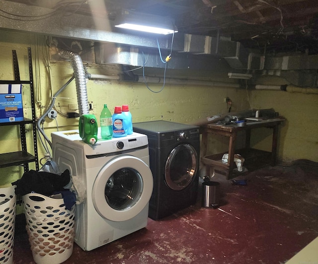 clothes washing area featuring independent washer and dryer