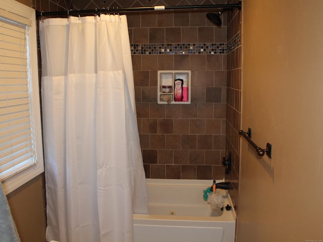 bathroom featuring shower / tub combo with curtain