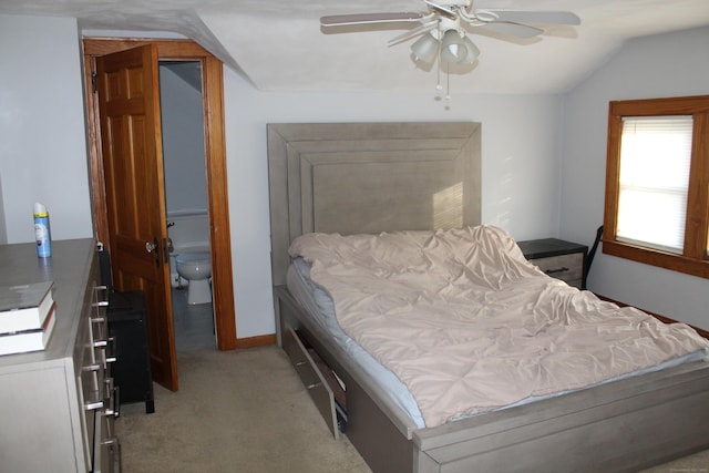 bedroom with ceiling fan, light colored carpet, and lofted ceiling