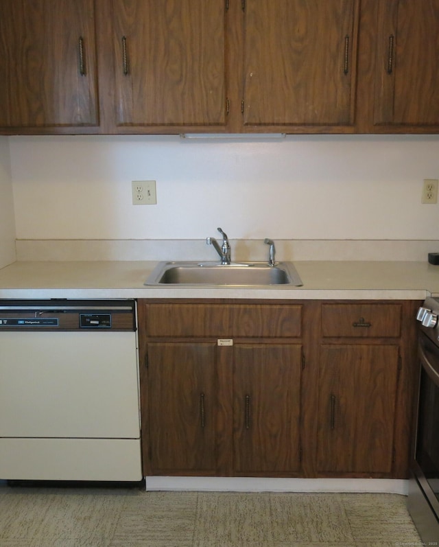 kitchen featuring sink, dishwasher, and stainless steel range