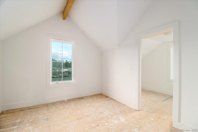 additional living space with lofted ceiling with beams