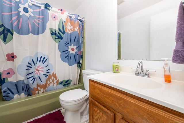 full bathroom featuring shower / tub combo with curtain, vanity, and toilet