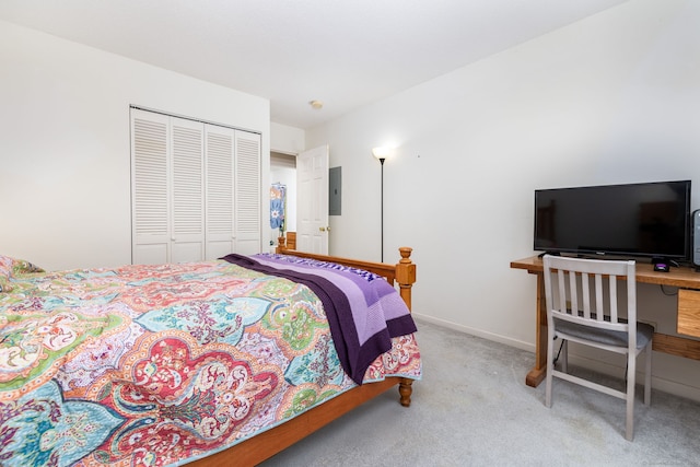 carpeted bedroom featuring a closet and electric panel