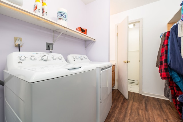 clothes washing area featuring washing machine and clothes dryer, a baseboard radiator, and dark hardwood / wood-style floors