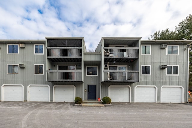 view of building exterior with an AC wall unit