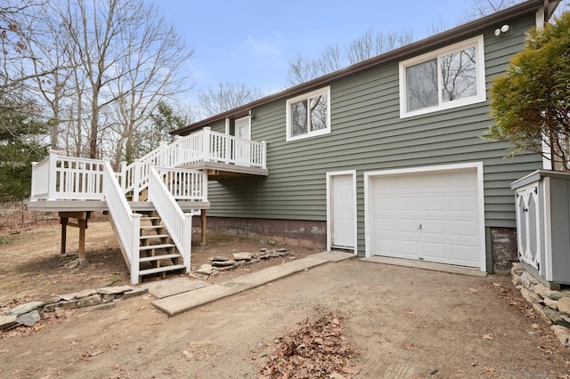 exterior space featuring a garage and a deck