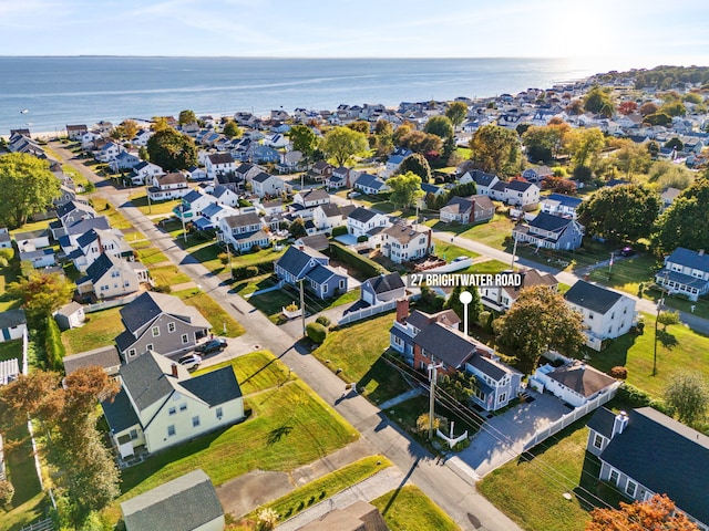 birds eye view of property featuring a water view and a residential view