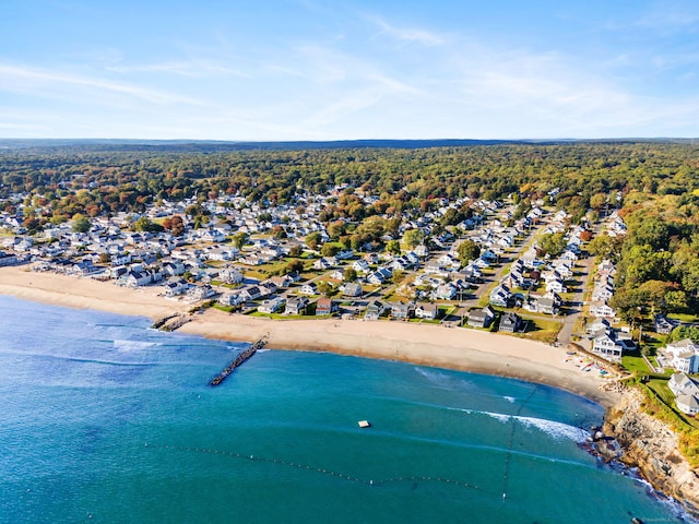 birds eye view of property with a beach view, a residential view, and a water view