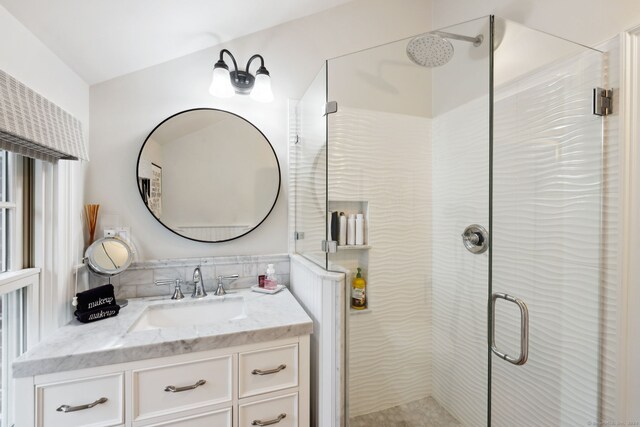 bathroom with vanity and an enclosed shower