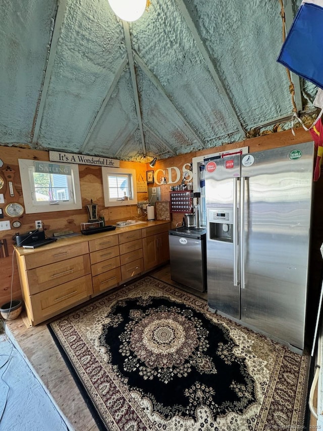 kitchen with fridge and stainless steel fridge with ice dispenser